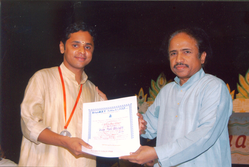 Receiving the title YUVA KALA BHARATHI from Violin Maestro Dr.L.Subramaniam, Chennai, India - 2004